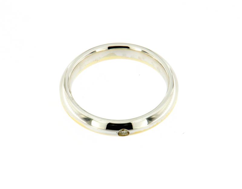 Anello due ori 750\1000 fede con diamantino centrale  misura 17